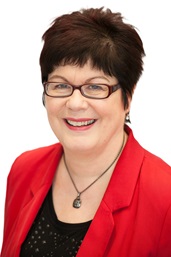 A headshot of deputy commissioner, Mary Craig